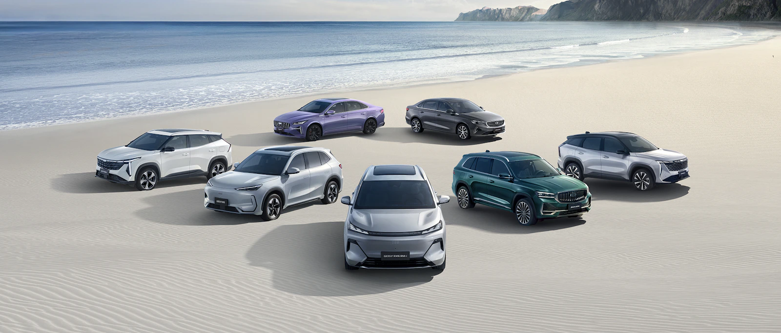 The Geely vehicle family together on the beach